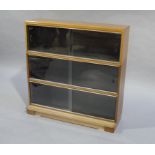 A Minty three stack bookcase with sliding glazed doors,