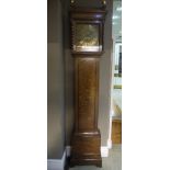 An late 18th/early 19th oak longcase clock having a brass dial with black Roman numerals,