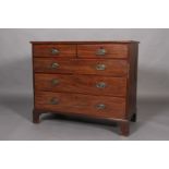 An early 19th century mahogany chest of drawers, crossbanded and inlaid with satinwood stringing,