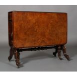 A regency mahogany table the rounded rectangular figured top above a central turned column,