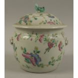 A 19th century Chinese famille rose circular pot and cover, decorated in typical palette,