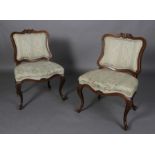 A pair of French oak chairs in Louis XV style,