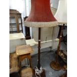 A Circular Based Mahogany Standard Lamp