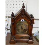 A Late Victorian Walnut Encased Mantel Clock With Brass And Silvered Dial