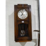 An Art Deco Period Pendulum Wall Clock With Silvered Dial