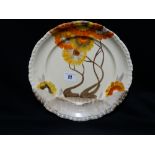 A Red And Yellow Floral Decorated Circular Clarice Cliff Plate