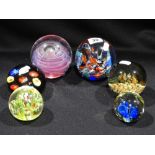 A Group Of Seven Mixed 20th Century Paperweights Together With A Circular Bubble Glass Bowl