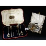 A Small Box Of Costume Jewellery Together With A Part Set Of Chester Silver Tea Spoons And Tongs