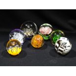 A Group Of Seven 20th Century Glass Paperweights