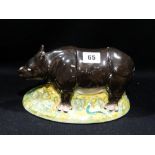 A Rare Staffordshire Pottery Tureen Cover In the form of a standing rhinoceros with serpents to the