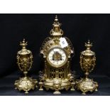 A Late Victorian Gilt Metal Clock Garniture With Circular Enameled Dial