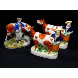 Three staffordshire pottery cow & milk hand creamers