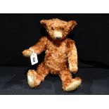 A Plush Teddy Bear With Moveable Limbs