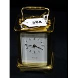 An English Brass Encased Eleven Jewel Carriage Clock, Retailed By Cottrills, In Working Order & With