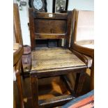 An Antique Oak Farmhouse Chair On Square Pegged Supports