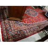 A Red & Blue Ground Patterned Oriental Carpet With Successive Borders, 137 X 97"