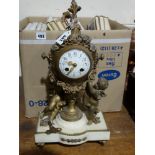 A Gilt Spelter & White Marble Based, Mantel Clock With Circular White Enamel Dial, Modelled As An
