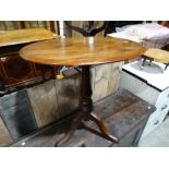 An Oval Topped Mahogany Tripod Occasional Table