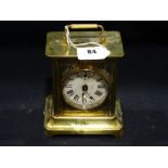 An Early 20th Century Brass Encased Carriage Clock With Circular Dial