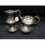 A Homeland Four Piece Beaten Pewter Tea Service, No 6430