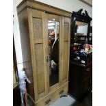 An Edwardian Oak Mirrored Single Door Wardrobe