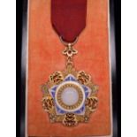 *China, Order of the Brilliant Jade, Eighth Class breast badge, in silver-gilt, silver and blue
