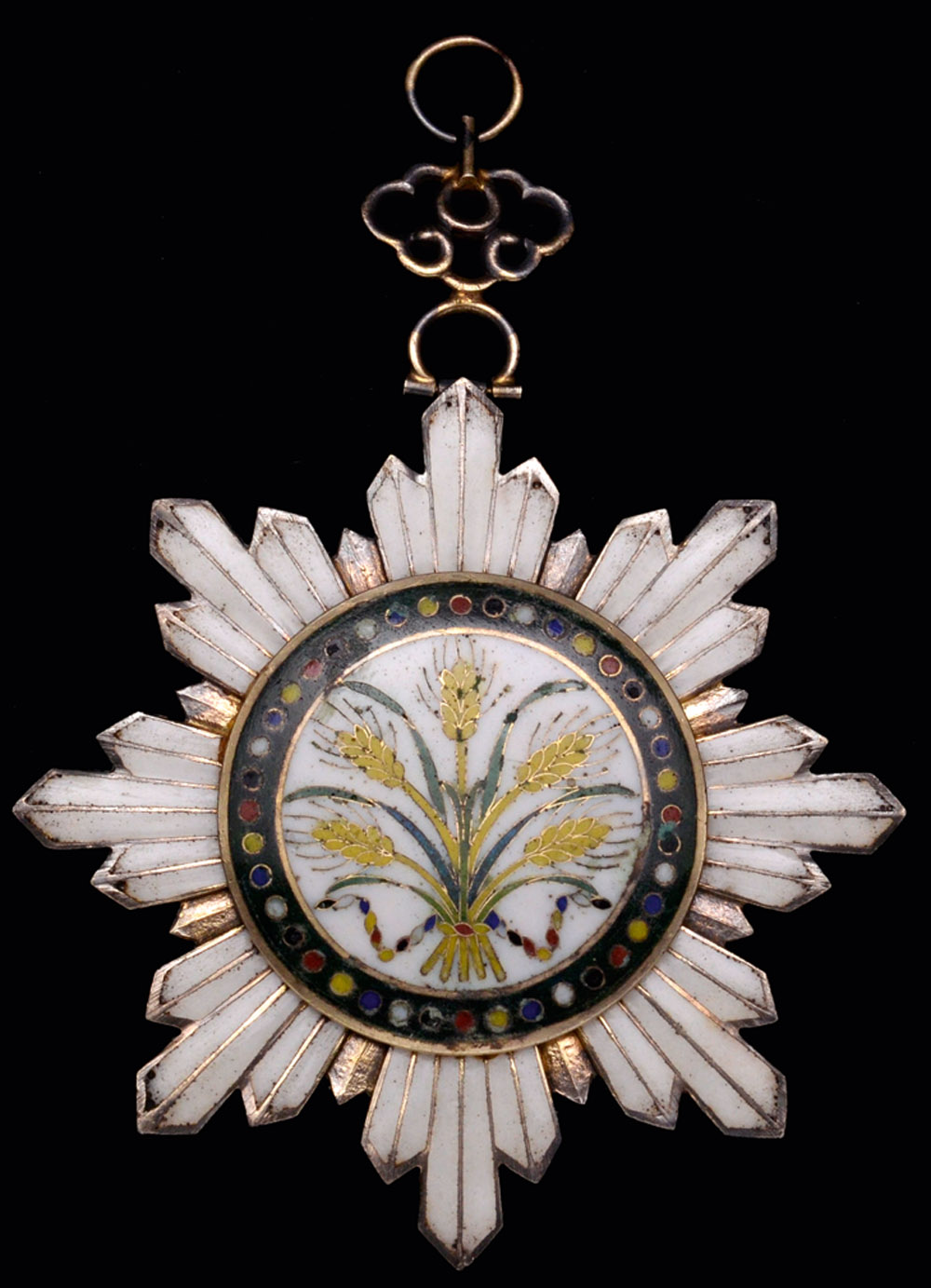 *China, Order of the Golden Grain, Third Class neck badge, in silver-gilt and enamels, width 60.5mm,