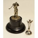 2x small silver golfing trophies to include golfing figure mounted on a wooden base, and white metal