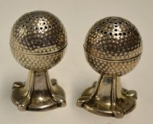 Pair of silver Bramble golf ball salt and pepper pots - hallmarked Birmingham 1915 both mounted on