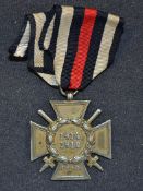 WWI 1914-1918 German Cross of Honour Medal Combatant grade with a pair of swords between arms, and