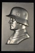 WWII German Officer Metal Plaque with large relief detail of soldier bust facing left, screwed