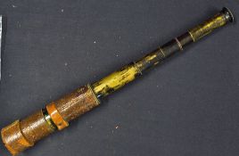 Retractable Brass and Leather Telescope extends into four parts with leather caps (damaged),
