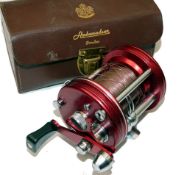 REEL: Abu Ambassadeur 6000 multiplier reel, 4 screw red grooved end plates, level wind, free