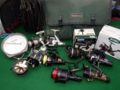 REELS & ACCESSORIES: Wychwood multi pocket tackle bag holding 9 reels incl. a boxed Mitchell