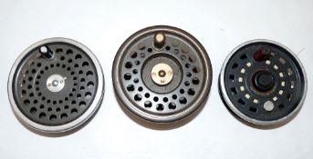 SPARES SPOOLS: (3) Three fly reel spare spools, a Hardy Golden Prince spool measuring 95mm across