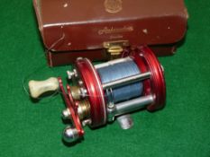 REEL: Abu Ambassadeur 6000 red multiplier reel, 4 screw, grooved end plate, single white handle,