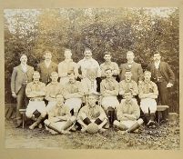 c.1900 Football Squad sepia photograph depicting a team scene with large trophy to centre, team