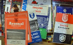 Selection of international football programmes from 1950s onwards to include mainly Scotland but
