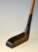 T Travers Patent wooden elongated mallet head putter by Cochranes Ltd showing the 11 circular lead
