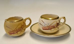 MacIntyre & Co porcelain coffee cup, saucer and an early creamer - each decorated with leather