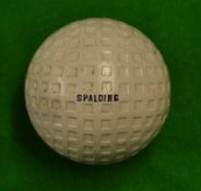 Spalding Square mesh golf ball retaining all of its original white finish