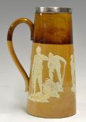 Fine Doulton Lambeth stoneware and silver rim golfing pitcher -the rim is hallmarked Sheffield 1906,