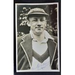 Sir Don Bradman Signed Cricket Photograph a black and white press photograph signed in blue ink to