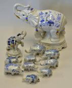 Selection of 11x Porcelain Elephants decorated in blue and white, larger elephant has China maker'