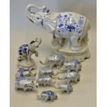 Selection of 11x Porcelain Elephants decorated in blue and white, larger elephant has China maker'