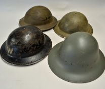 A collection of classic WWII helmets - comprised of 2x Brodie or Tommy helmets, a Zuckerman or Civil
