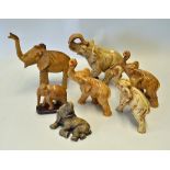 7x Assorted Elephant Statues/Ornaments various shapes and sizes, coffee coloured, a wooden figure on