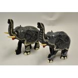 Nice Pair of Ebony Wood Elephants decorated in green and white pattern, one missing tusk,
