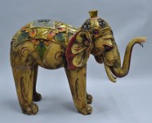Large hand painted Wooden Elephant colourfully decorated with gold gilt, with some cracking to