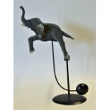 Interesting Metal Rocking Elephant and Stand measures 46cm height, perfectly balanced designed to